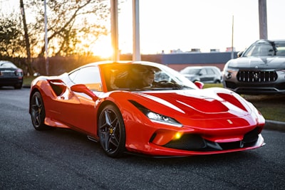 red ferrari 458 italia on road during daytime ferrari teams background