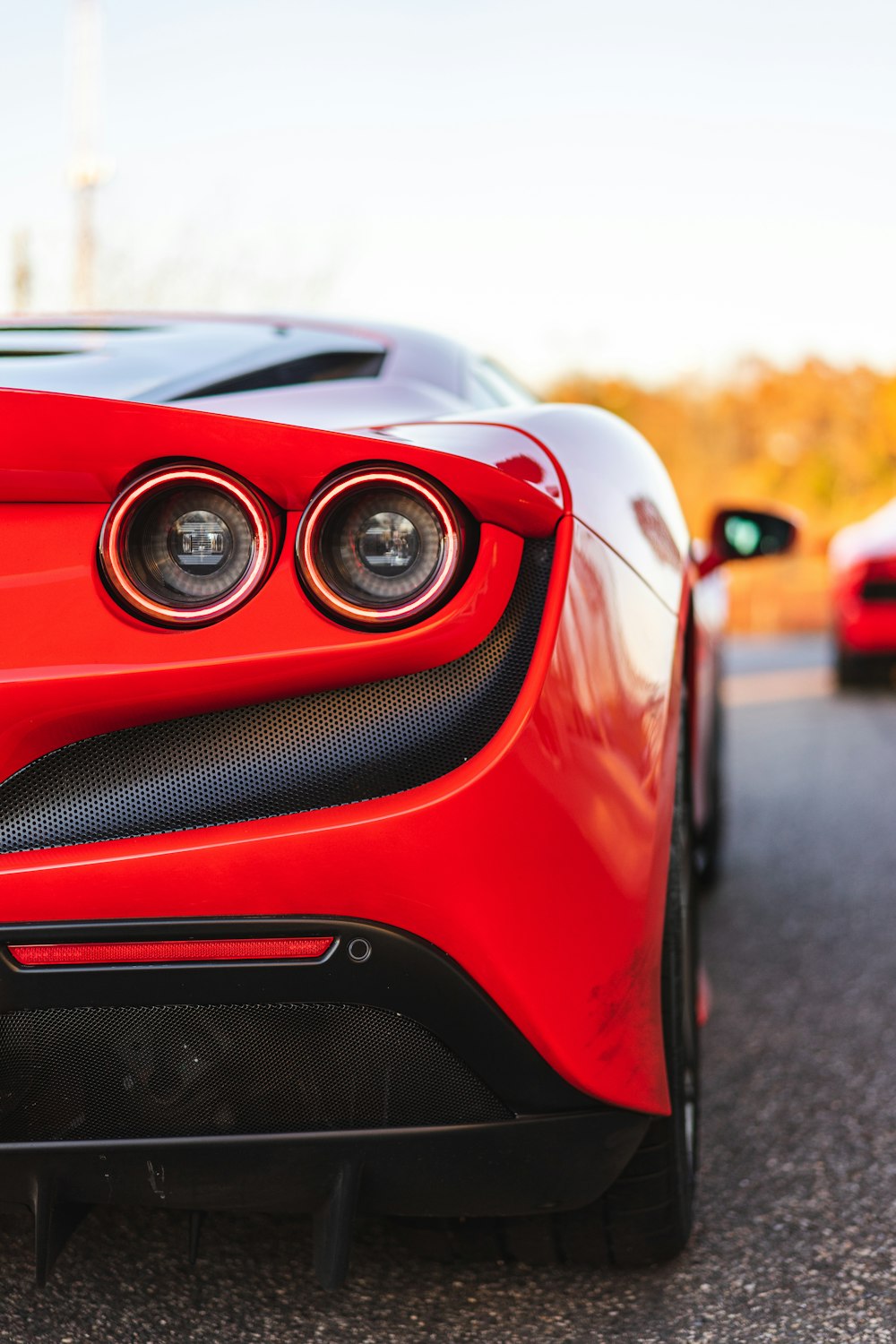 red car on road during daytime