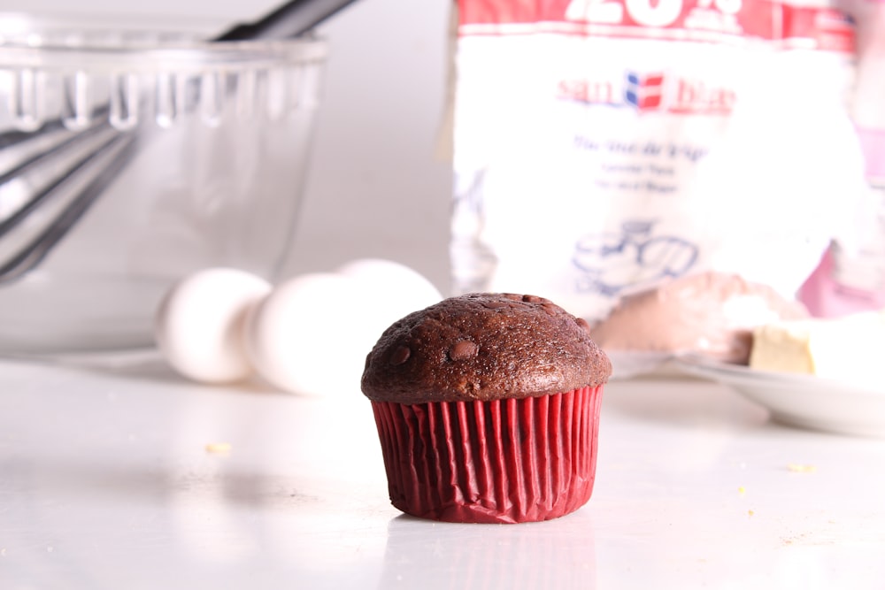 brown cupcake on white table