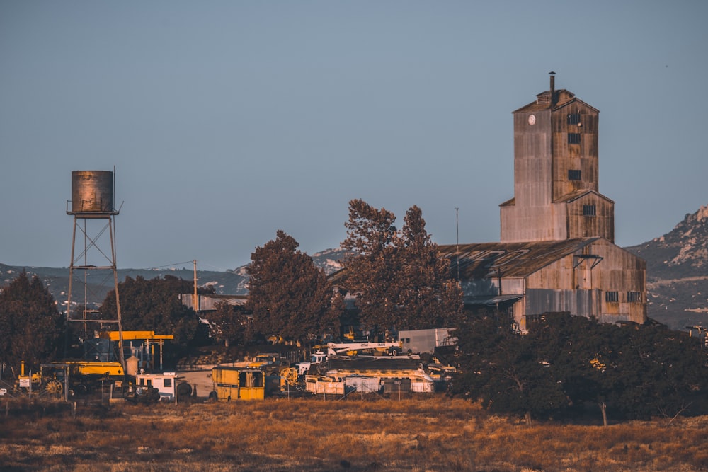 brown concrete building near trees during daytime