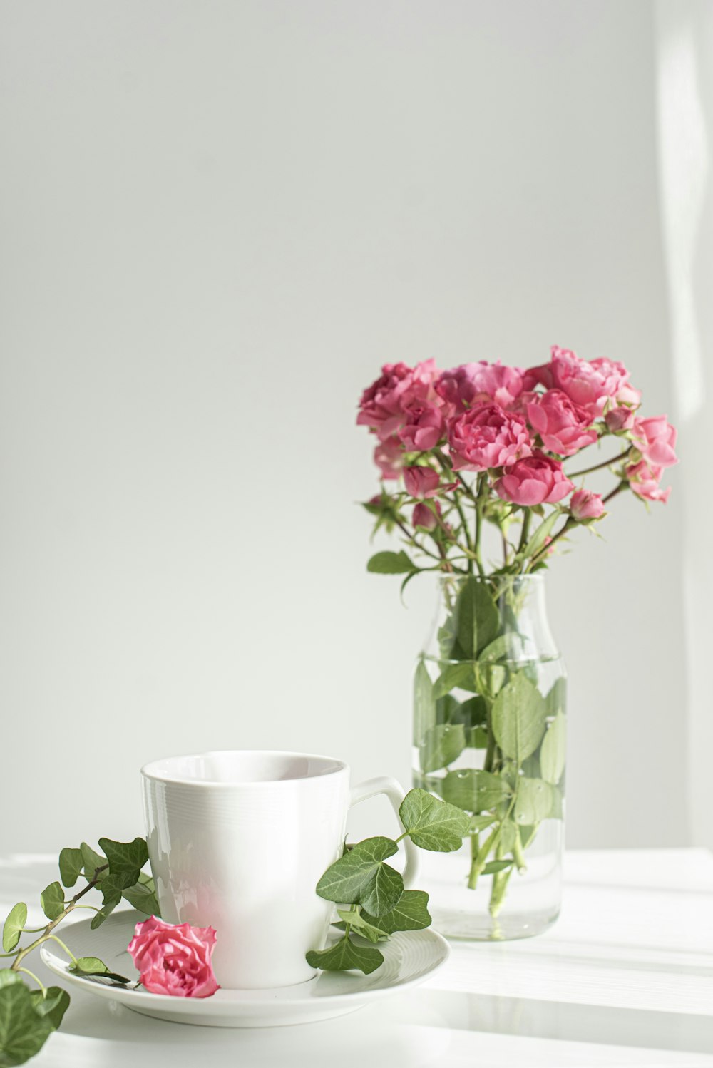 pink flowers in clear glass vase