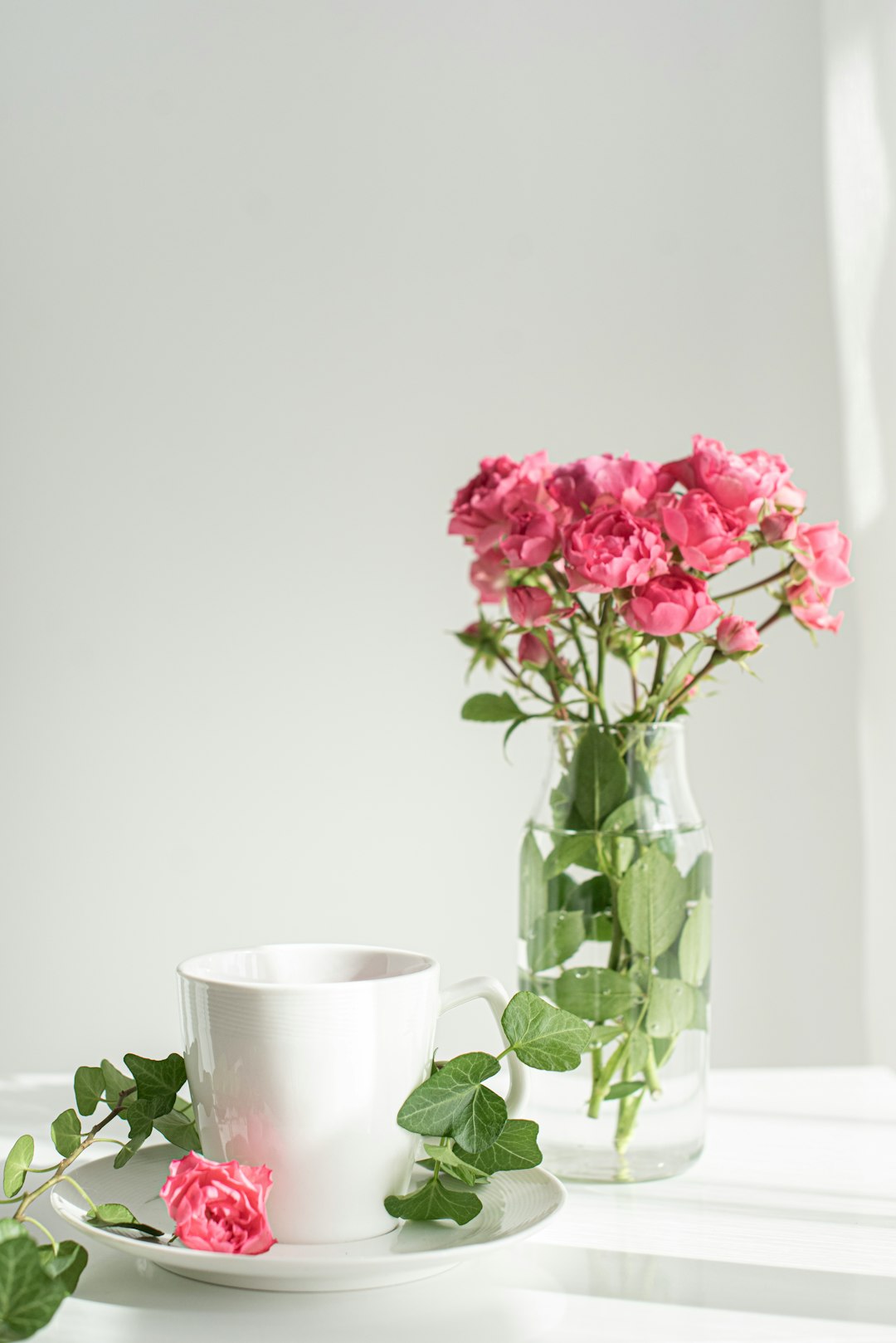 pink flowers in clear glass vase