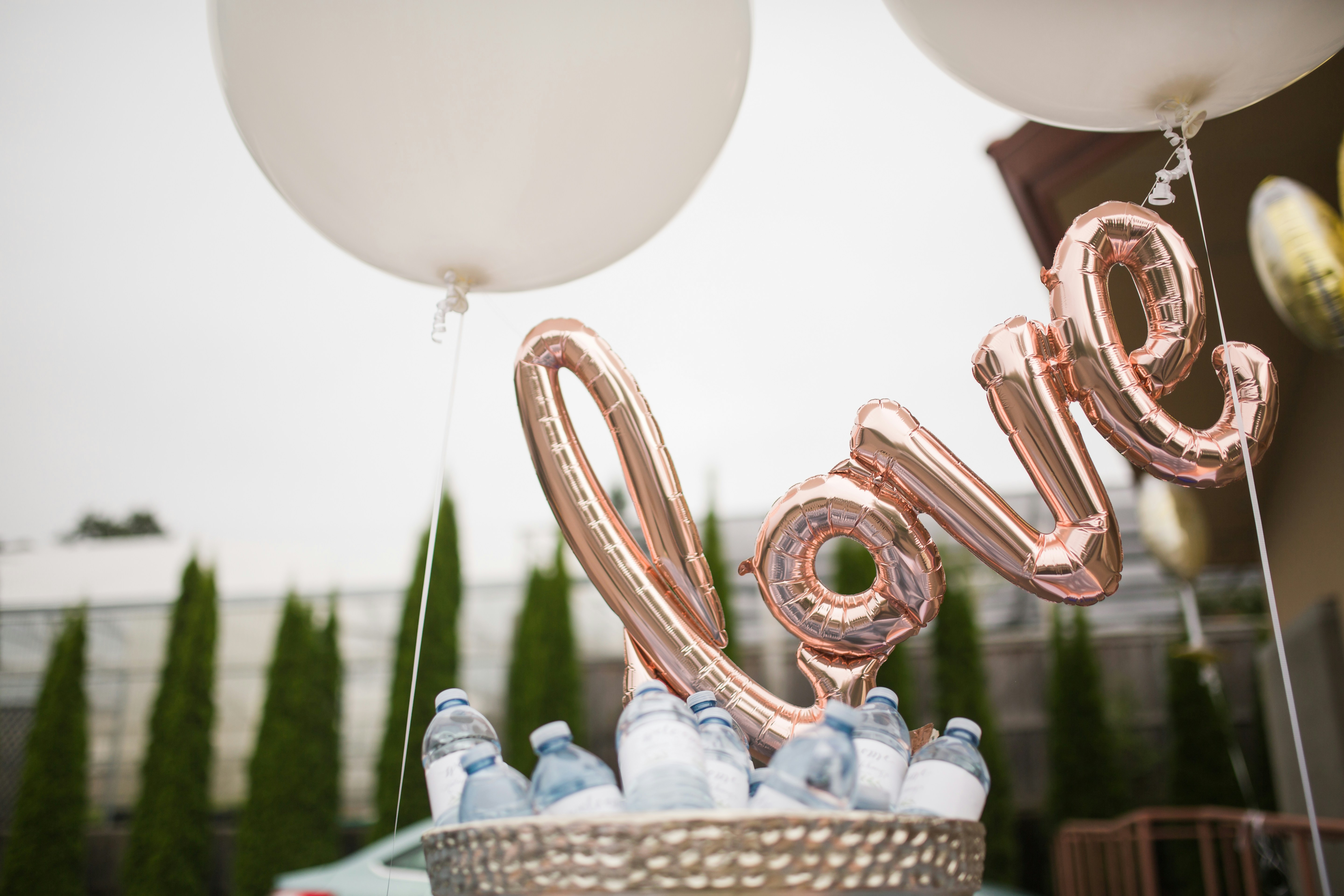 corporate event planning - gold balloons spelling "love"