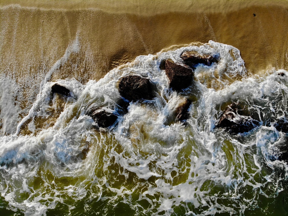 water waves on brown sand