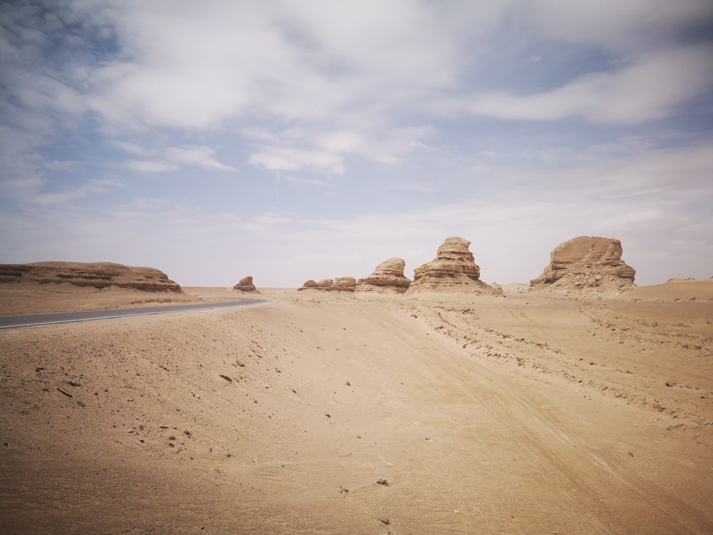 brown sand under blue sky during daytime