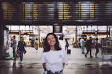 woman in white crew neck t-shirt standing on white floor tiles