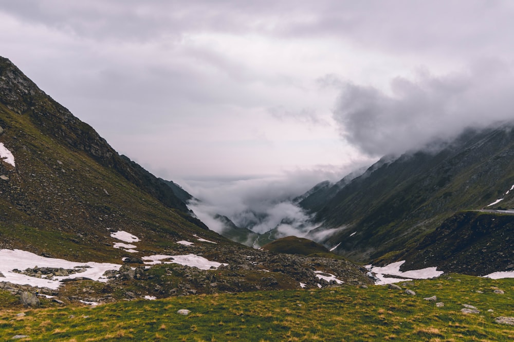 green and brown mountains under white clouds