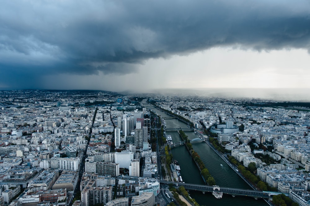 city buildings under white clouds during daytime