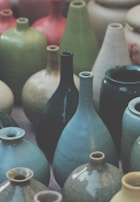 A collection of unique wooden vases in various shapes.