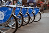 blue and black bicycle on road during daytime