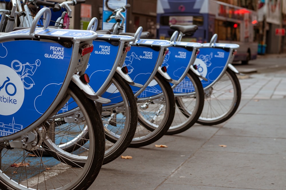 blue and black bicycle on road during daytime