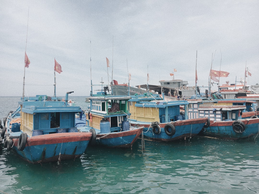 blue and brown boat on water during daytime