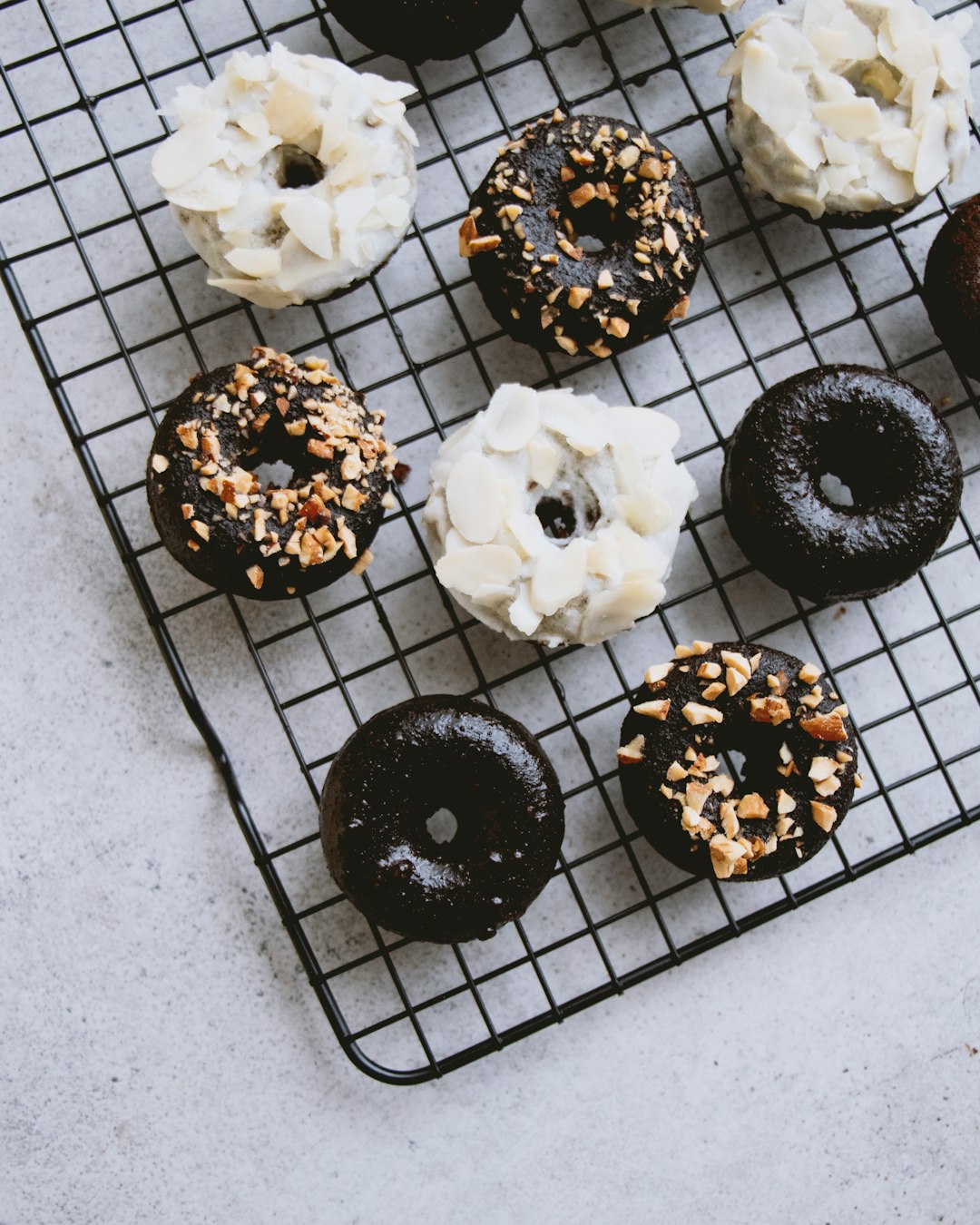 white and black round pastries on black metal tray