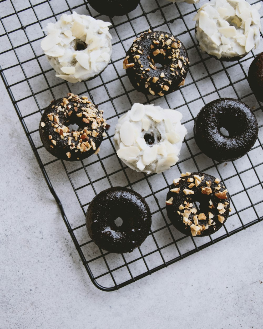 white and black round pastries on black metal tray