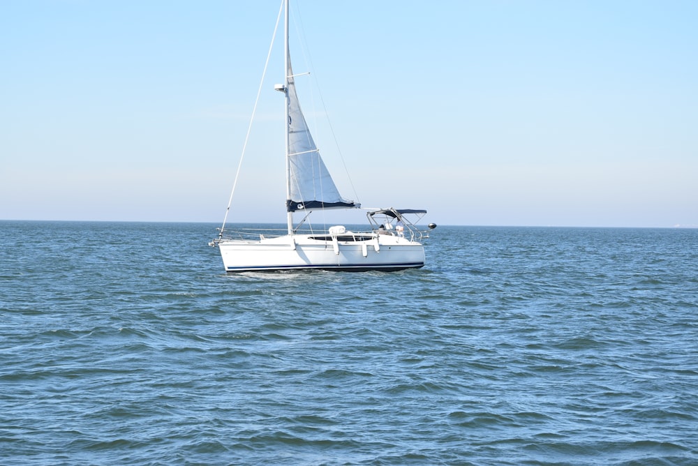 white sailboat on sea during daytime