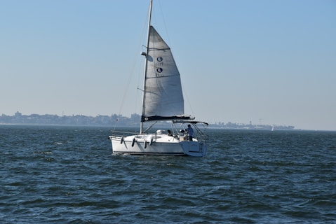 white sailboat on sea during daytime