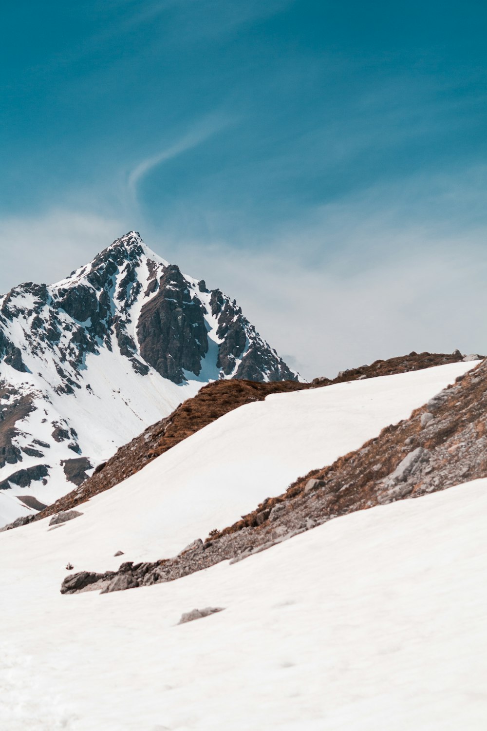 snow covered mountain under blue sky during daytime