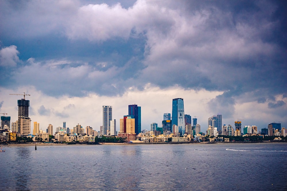 city skyline under cloudy sky during daytime