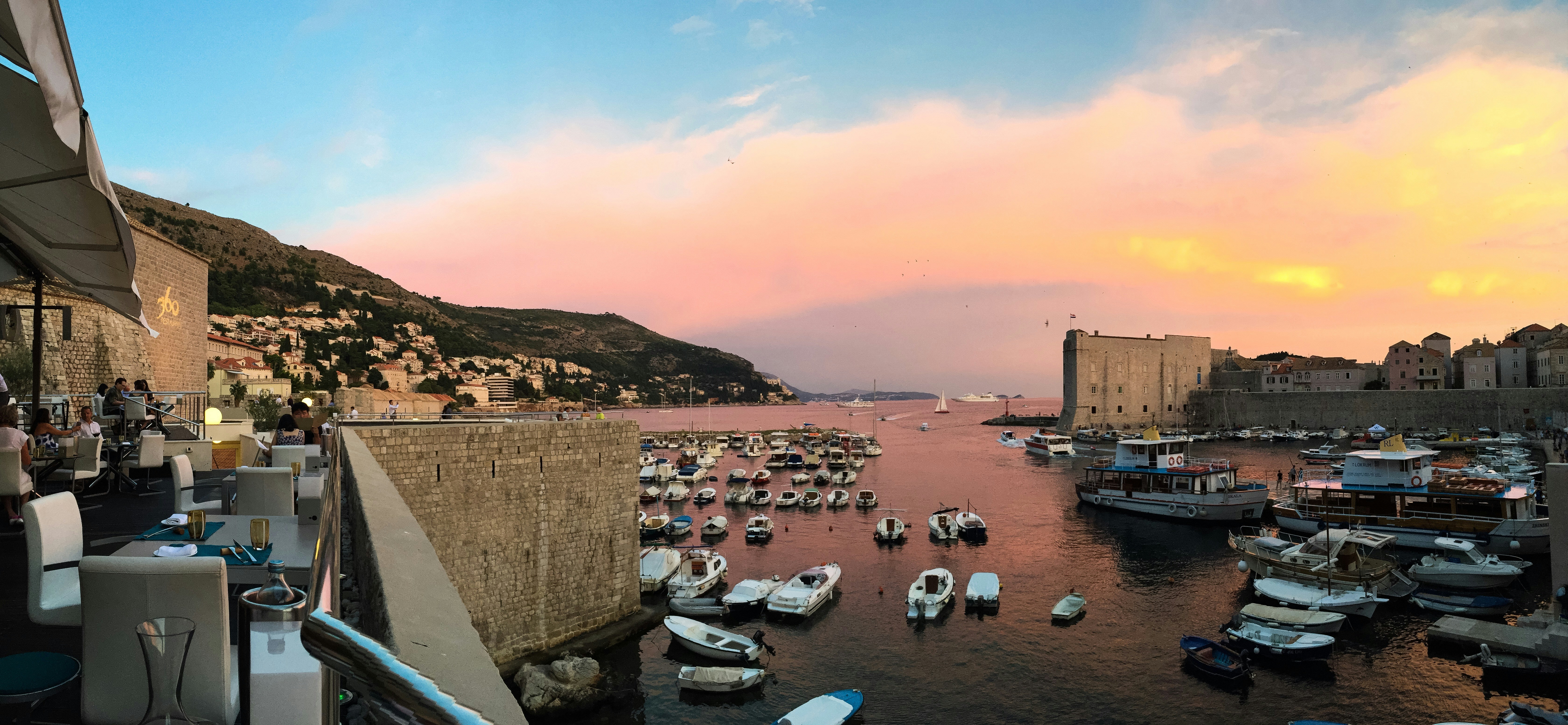 White and blue boats on sea dock during daytime