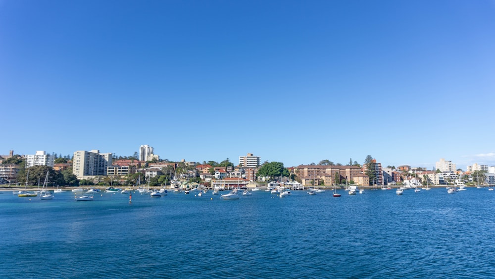 city skyline across blue sea under blue sky during daytime