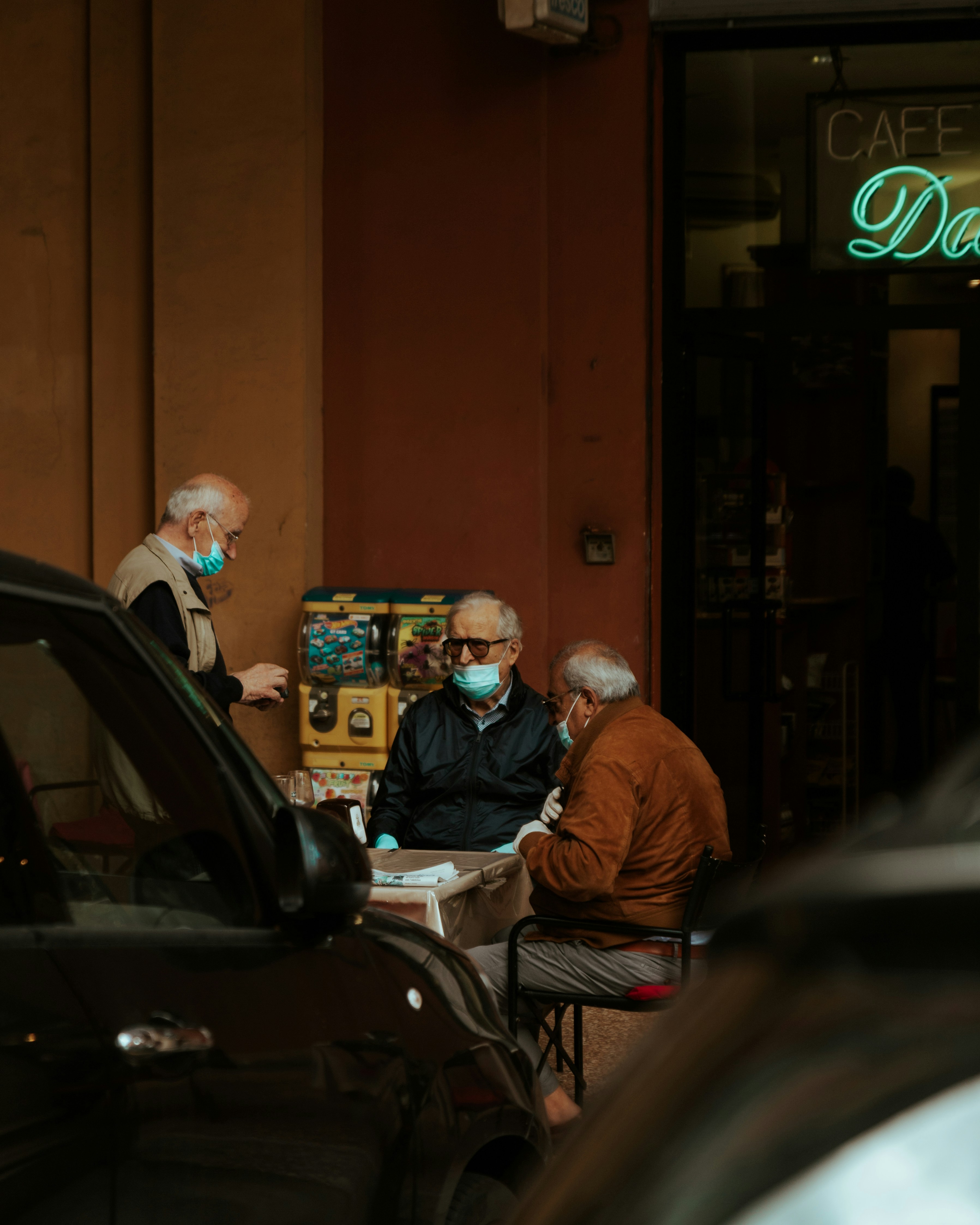 man in brown jacket sitting beside woman in black jacket