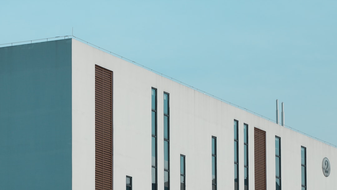 white concrete building under blue sky during daytime