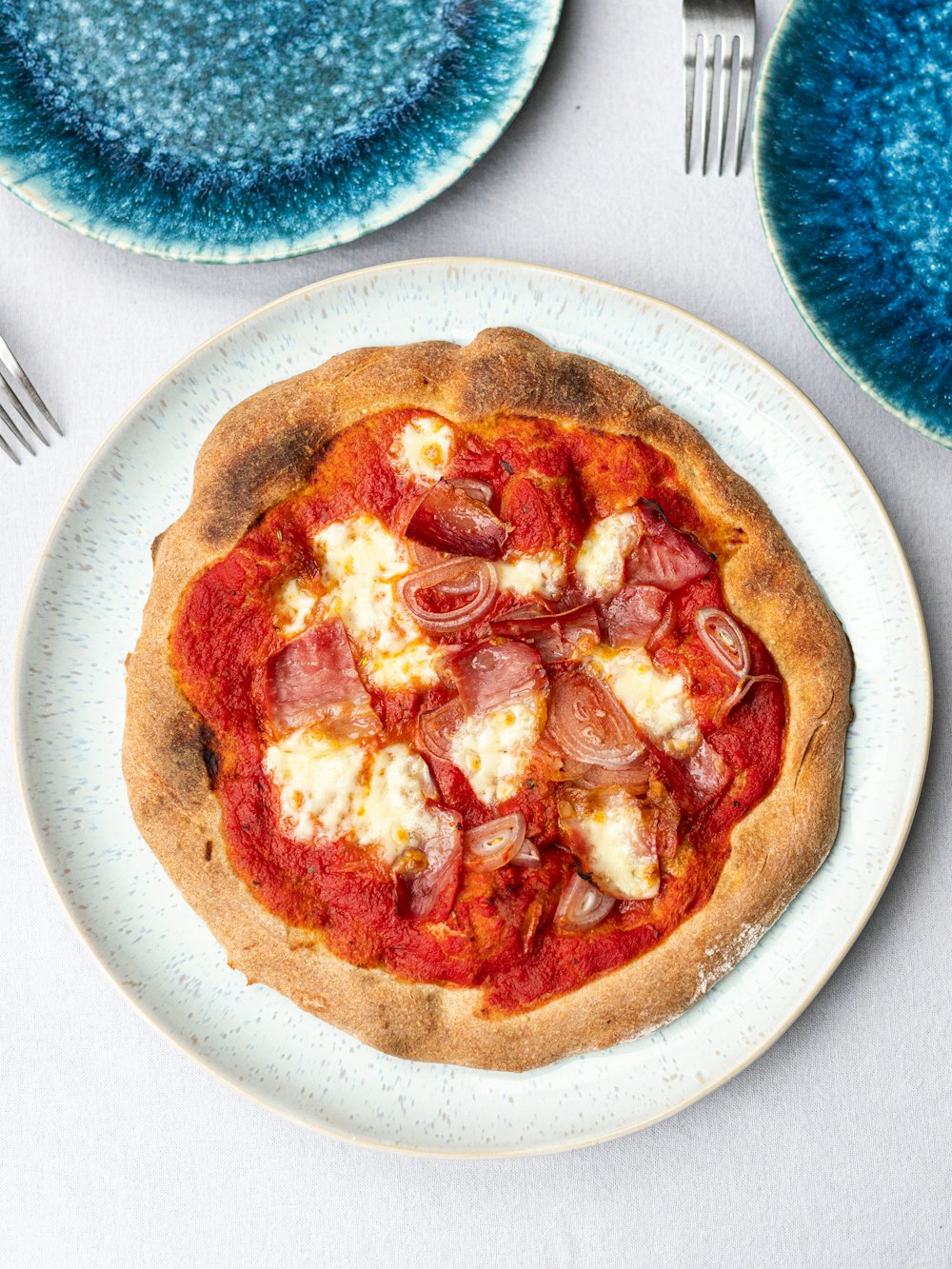 pizza on white ceramic plate