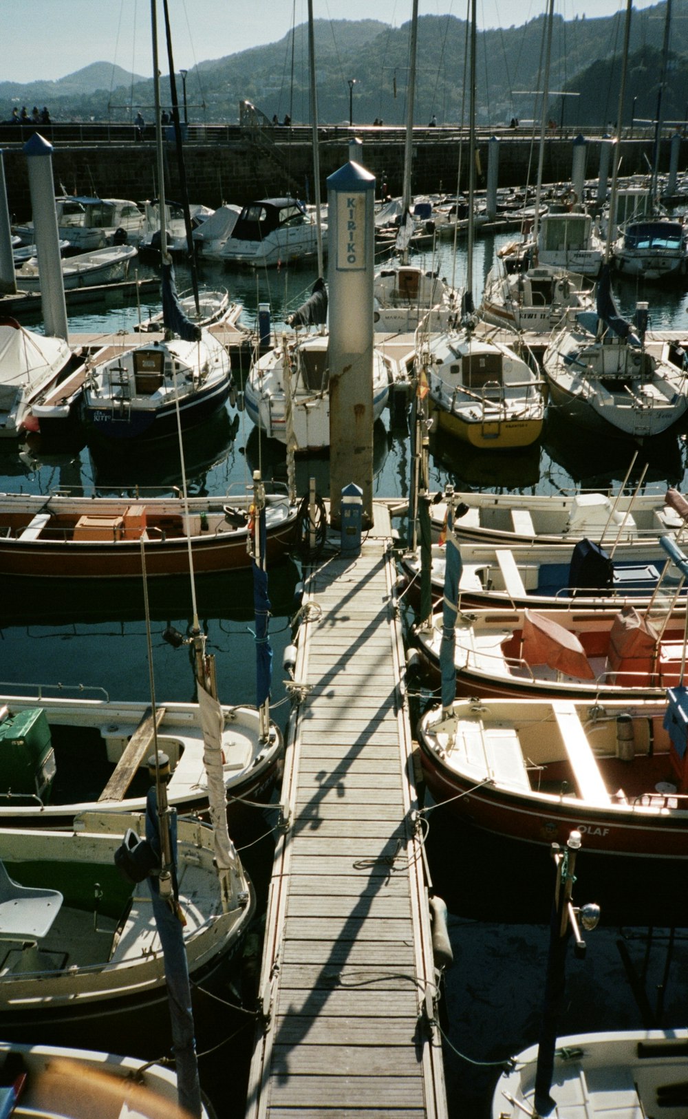 white and brown boat on dock during daytime