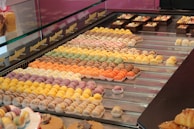 Colorful macarons displayed in a pastry shop.