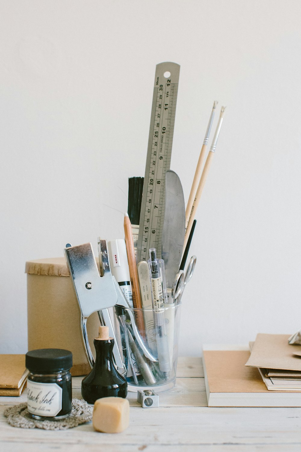 brown wooden handled scissors and pencils