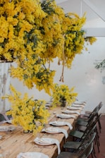 Bright mimosa breakfast setup with fresh flowers and stylish tableware