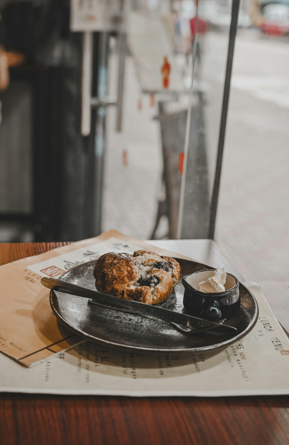 brown and white pastry on black ceramic plate