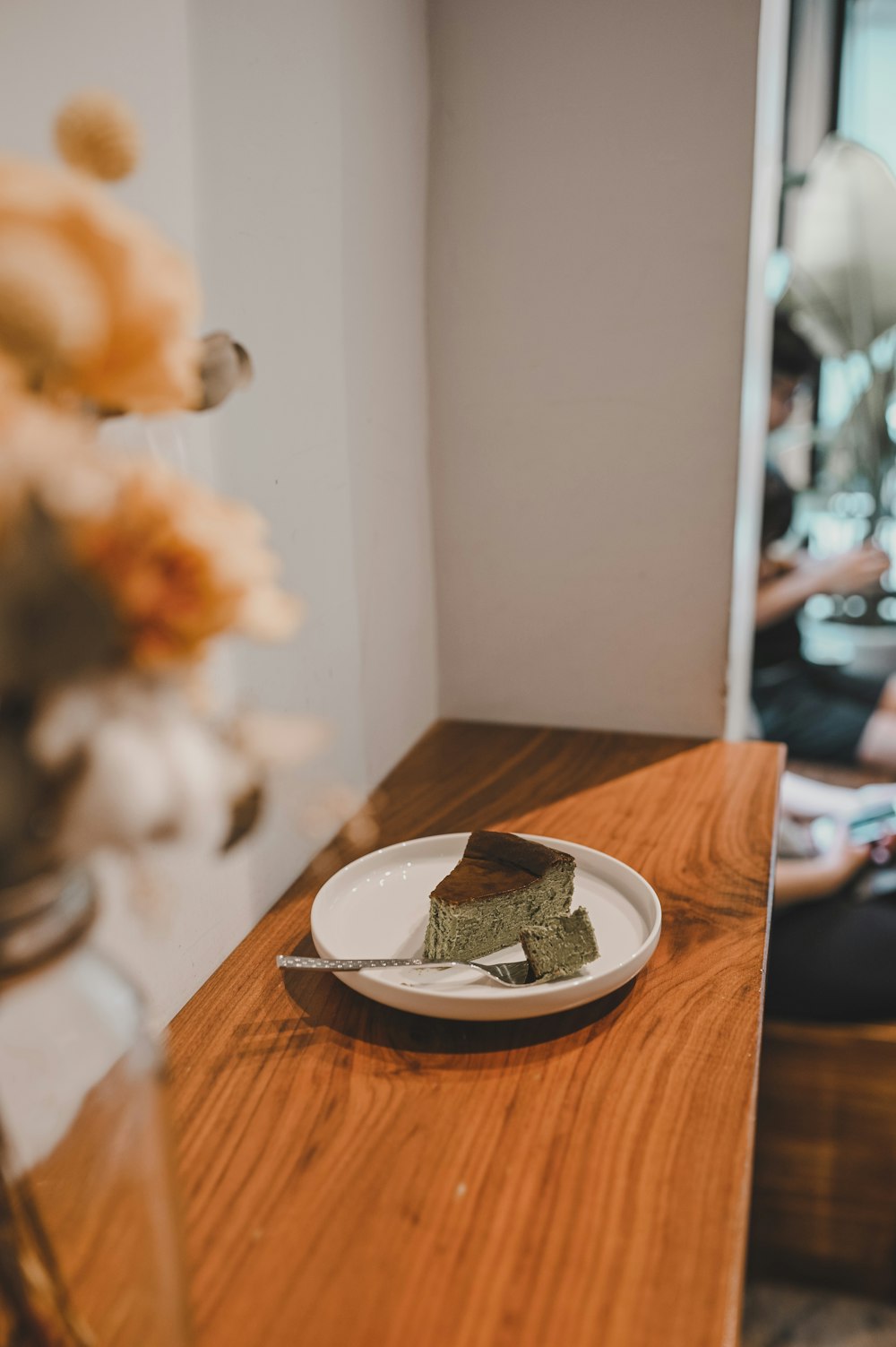 white ceramic plate on brown wooden table