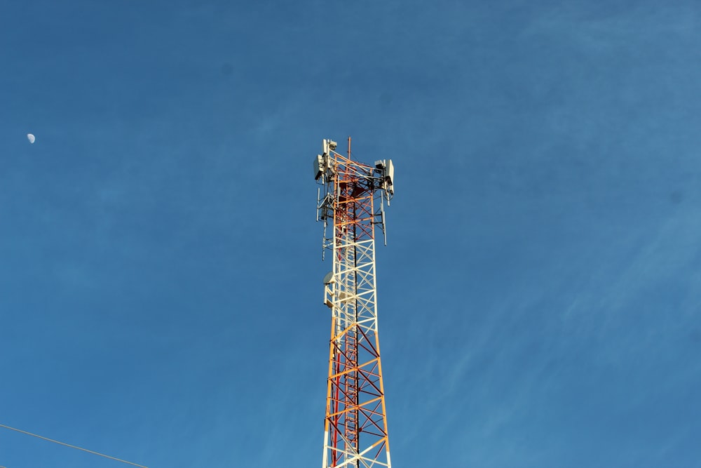 red and white tower under blue sky