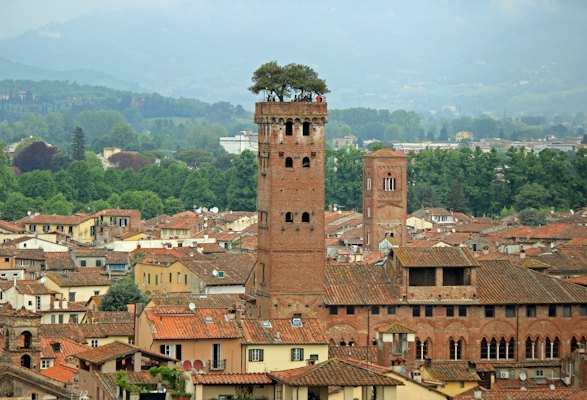 Brown concrete building during daytime — Lucca, Italy