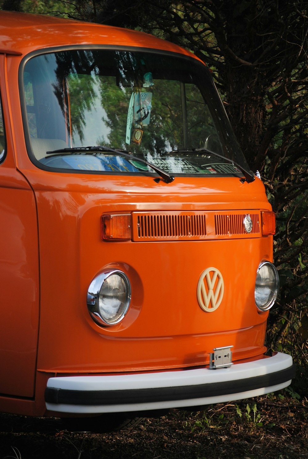 orange and white volkswagen t-2 van