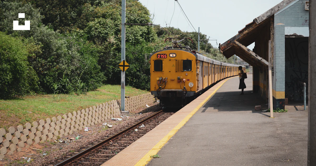 Yellow train on rail road during daytime photo – Free Durban Image on ...