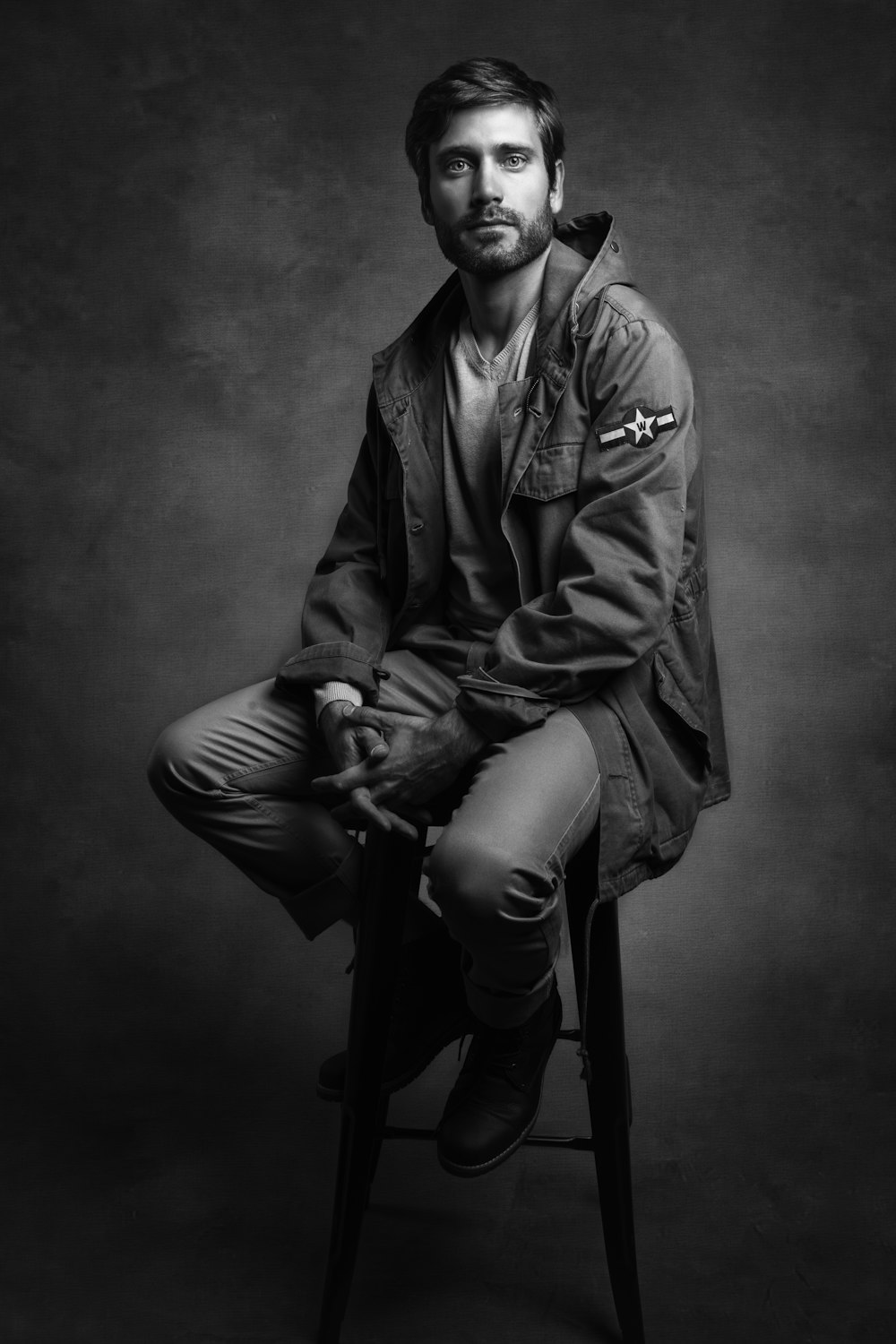 man in black leather jacket and pants sitting on seat