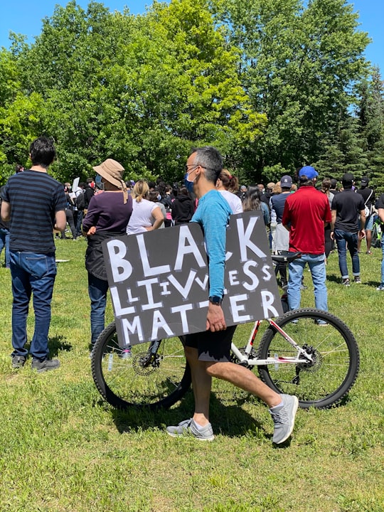 people gathering on green grass field during daytime in Toogood Pond Park Canada