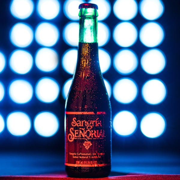 Red wine vinegar bottle on red table