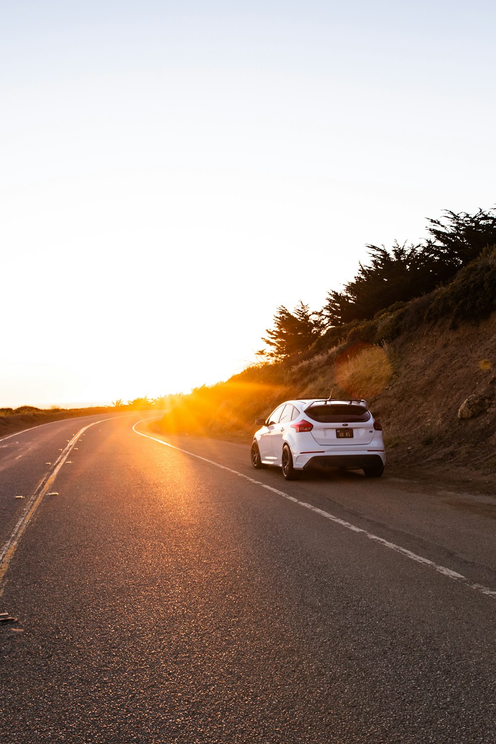 white car on road during daytime