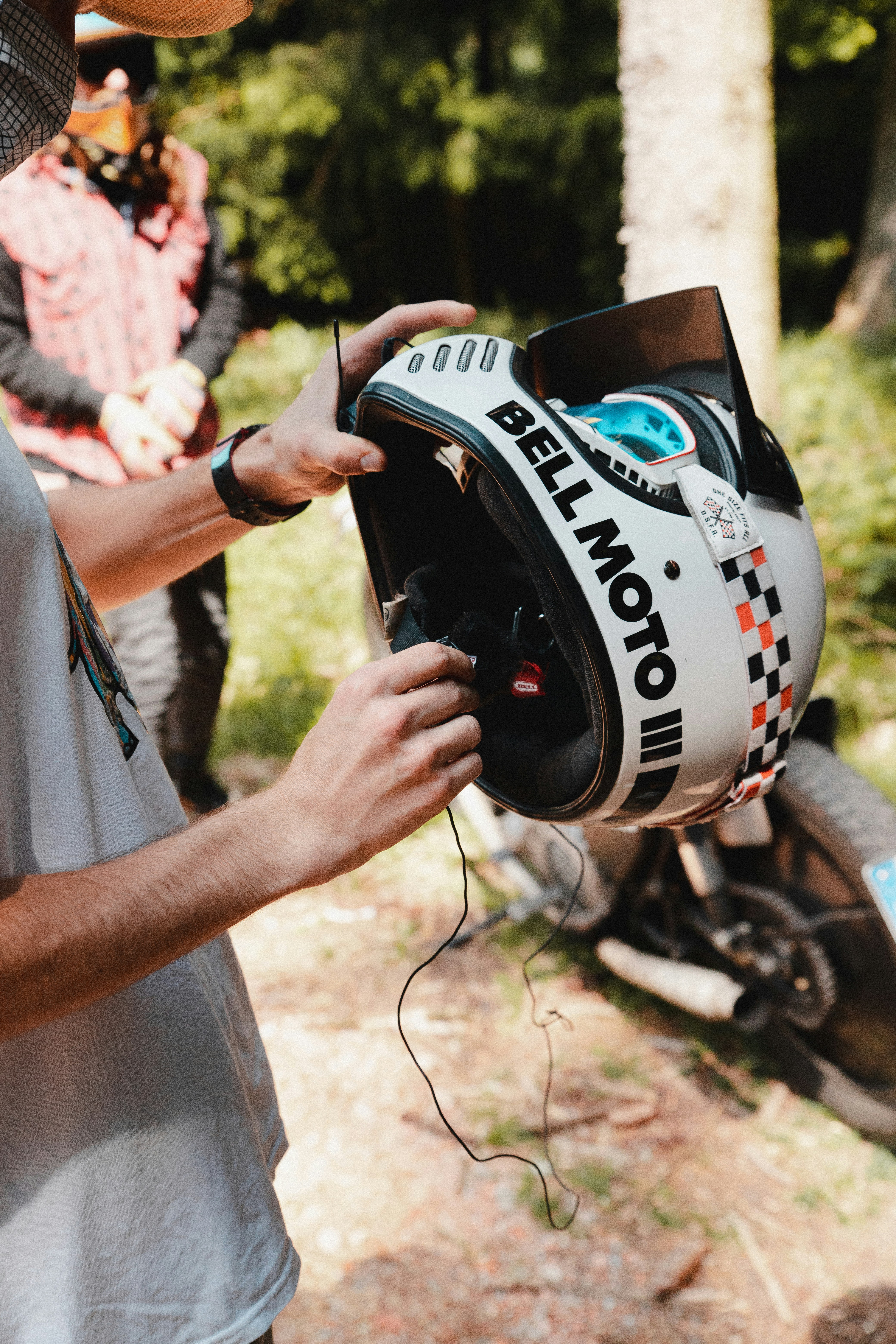 a man holding a helmet in his hand
