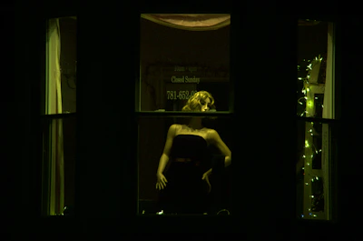 A high-street fashion window display glowing warmly under low-heat LEDs, showcasing intricate fabric weaves without damage.