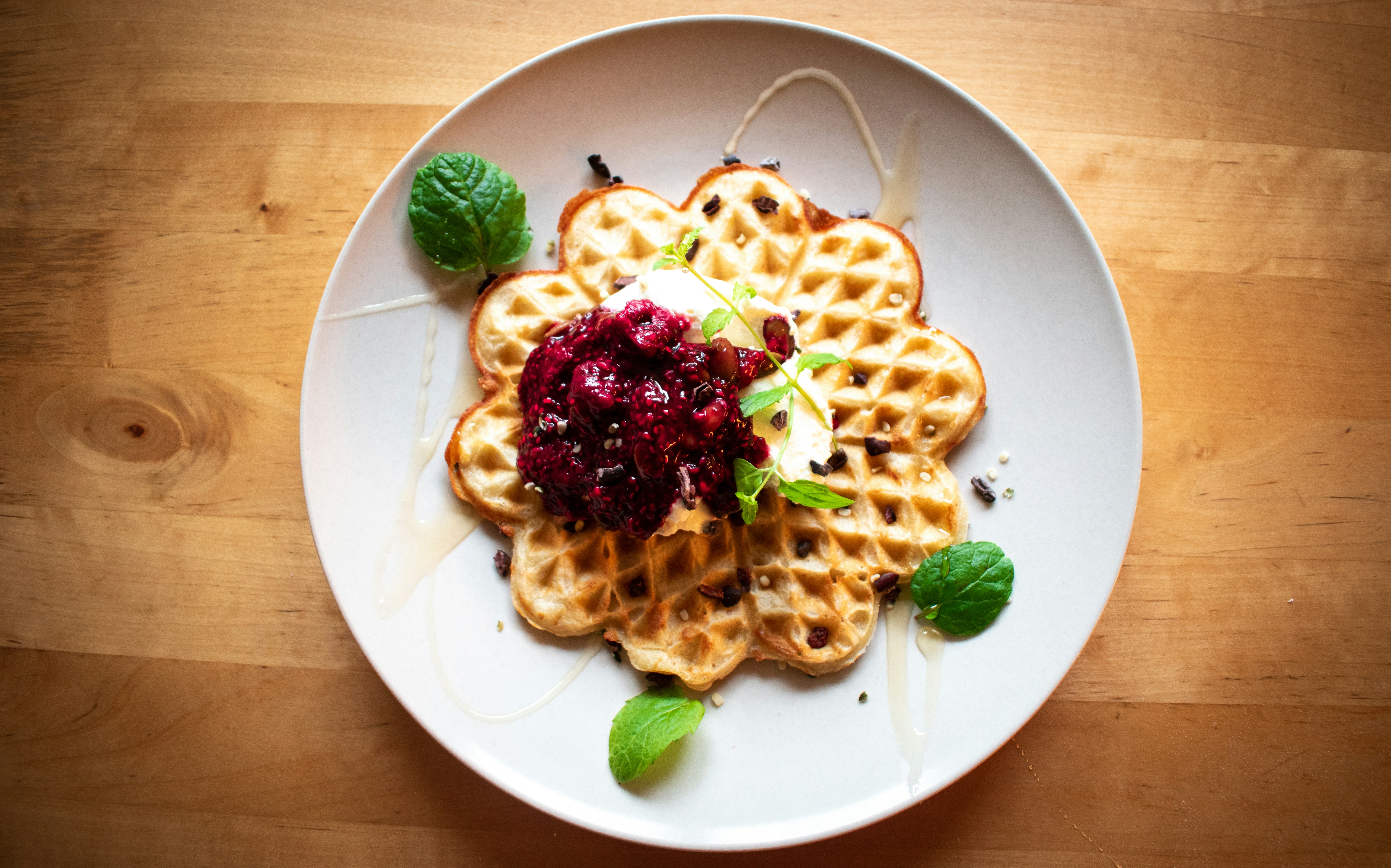 pasta with green leaf on white ceramic plate