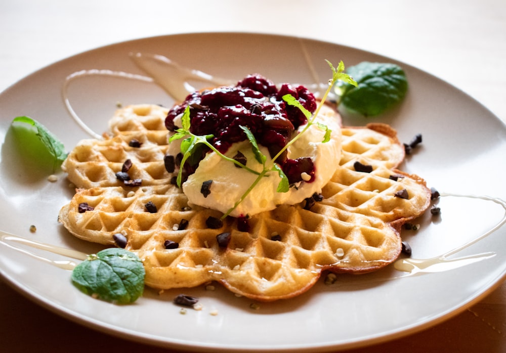 waffle with green and purple vegetable on white ceramic plate