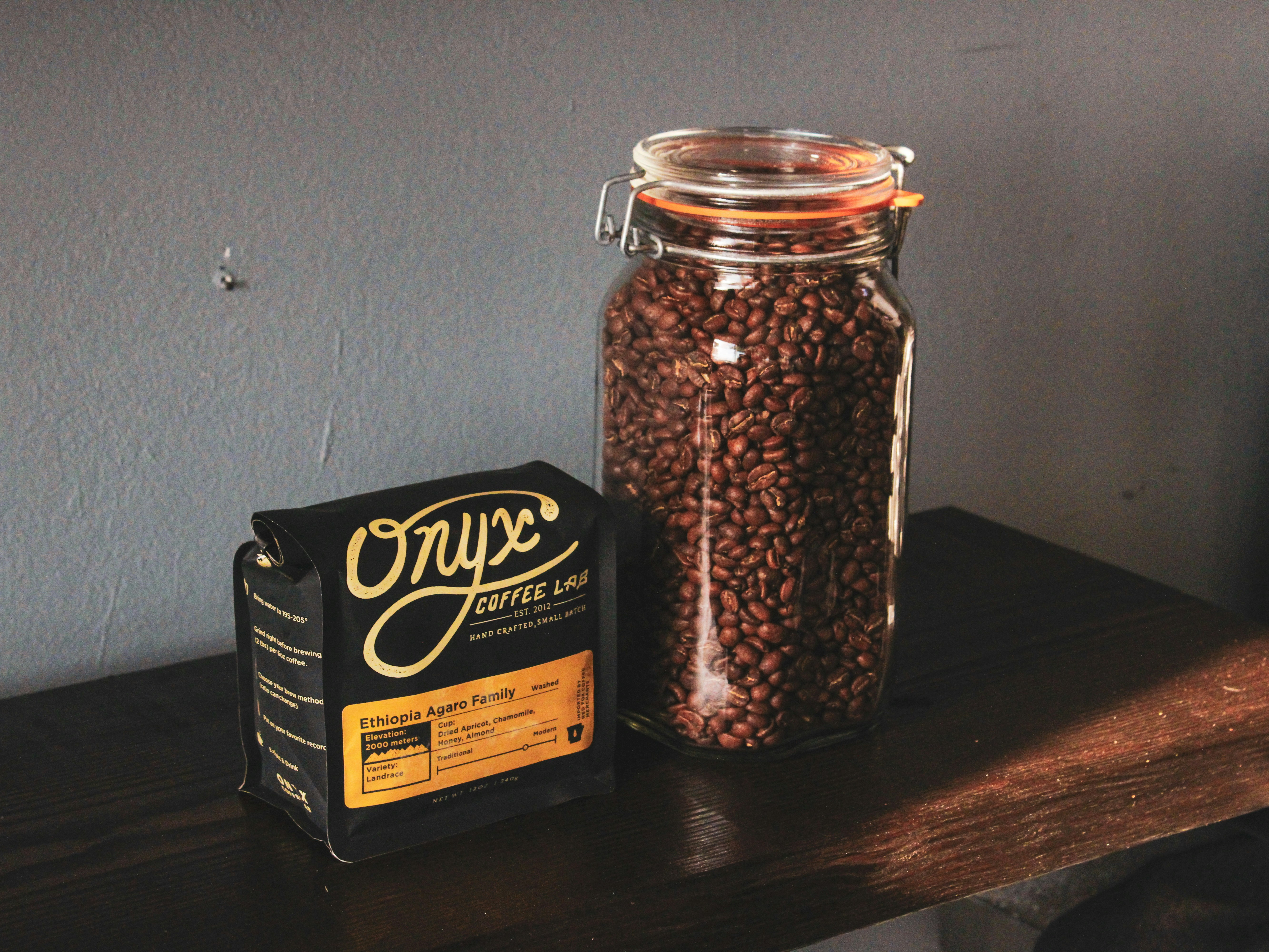 black and brown labeled jar