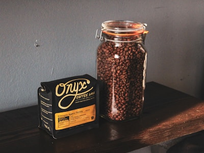 black and brown labeled jar