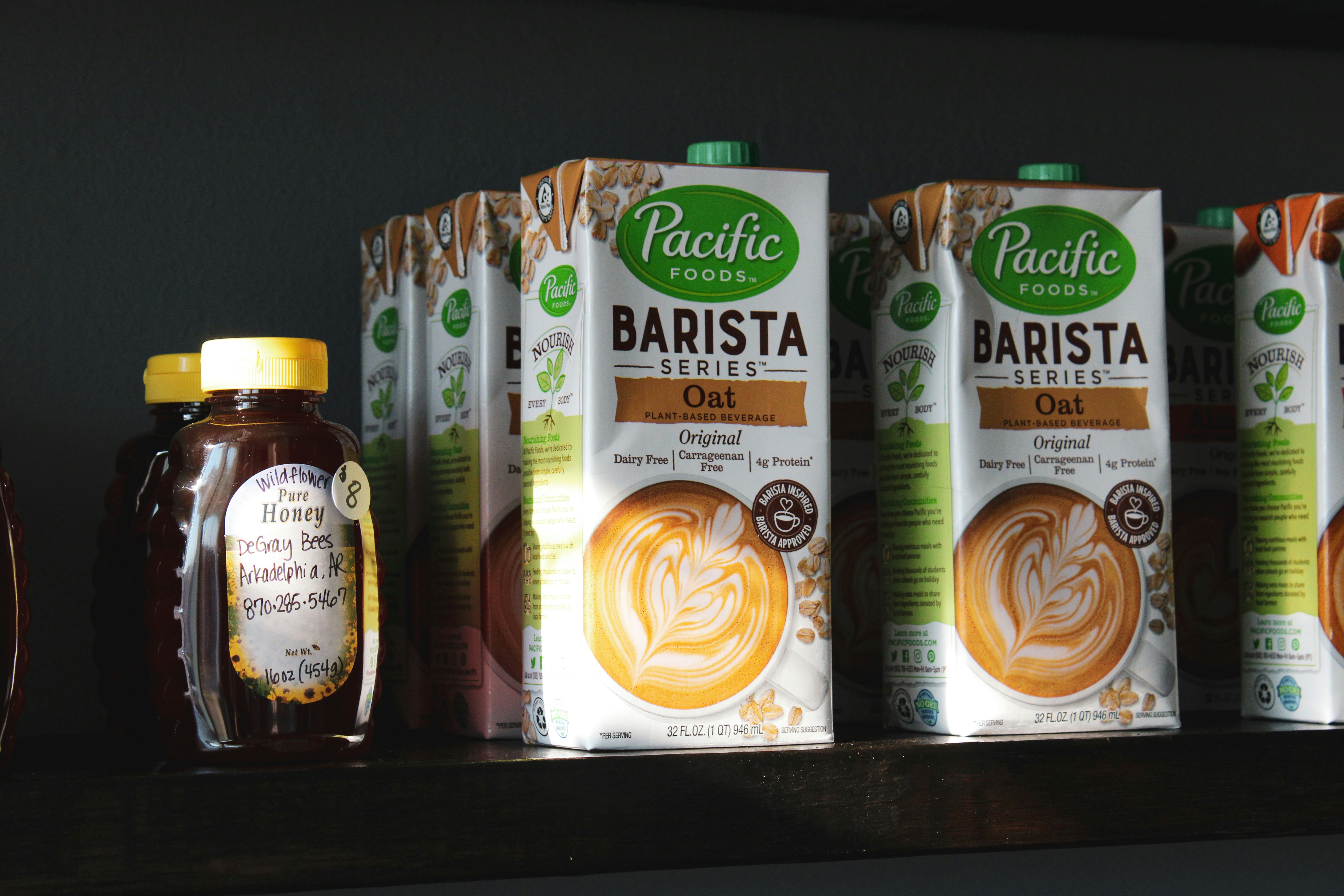 a shelf filled with different types of coffee