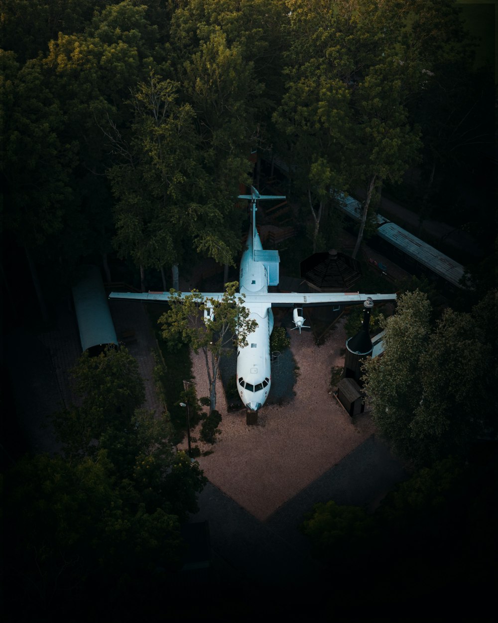 white and blue airplane on mid air during daytime