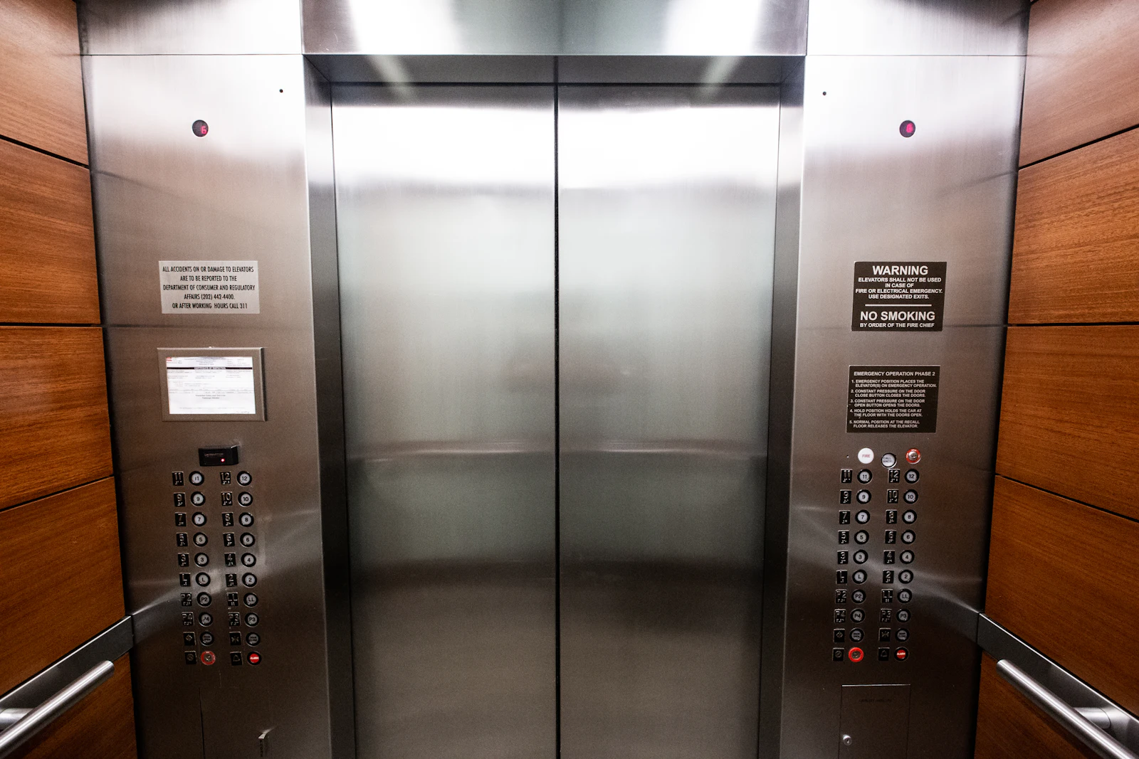 Modern elevator interior with stainless steel panels
